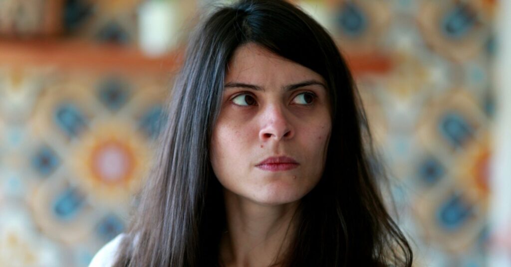 Image of a woman repressing her anger